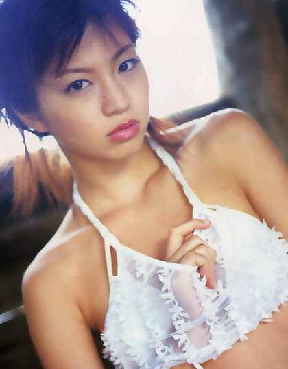 Delicious asian babe shows off her plump petite boobs in a bikini